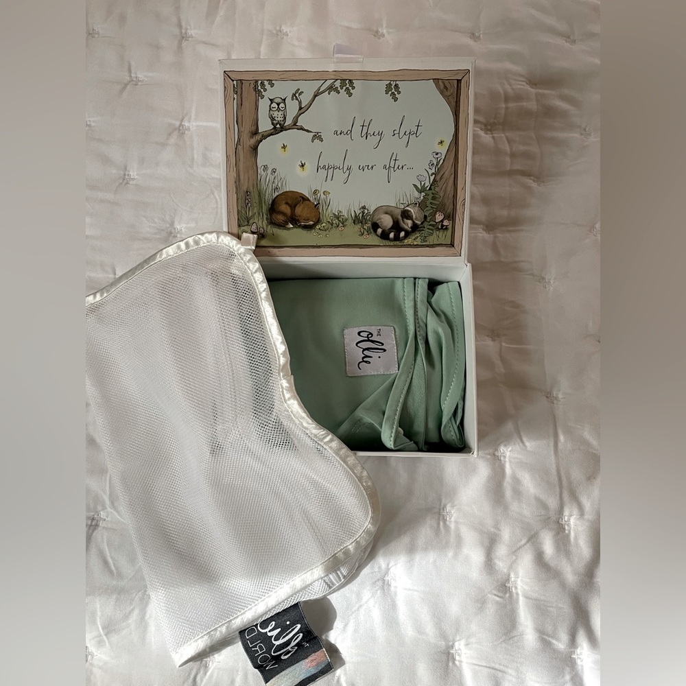 Like new Ollie swaddle with box and garment bag